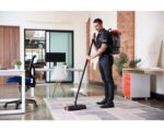 ACTIV8 battery powered vacuum head with 360-degree swivel joint and dual counter rotating brushes for commercial cleaning